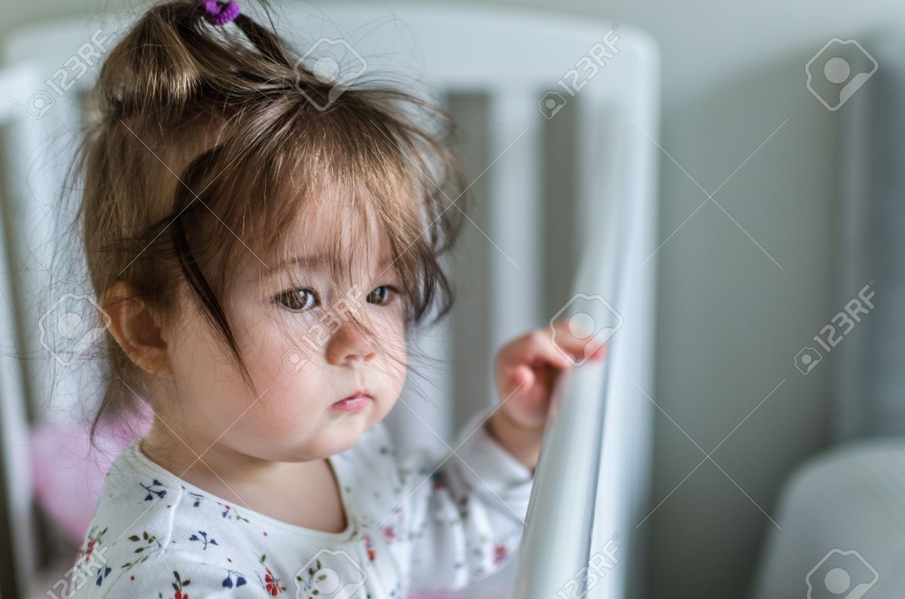 Portrait Of Cute Little Baby Girl With Black Brunette Hair In White Patterned With Flowers Long Portrait Of Cute Little Baby Girl With Black Brunette Hair In White Patterned With Flowers Long