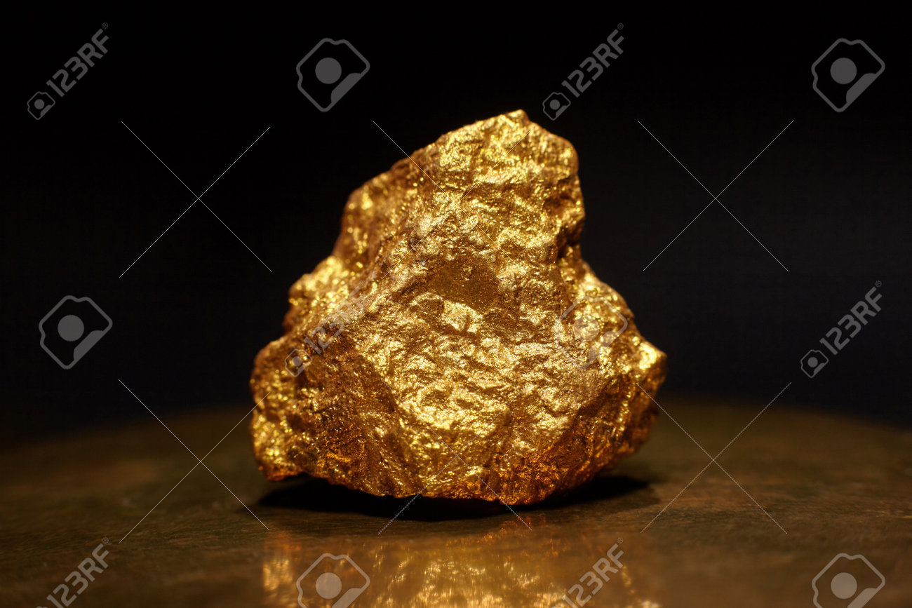 Close Up Of Big Gold Nugget. Finance And Business Concept. Gold Ore Found  In The Mine. Trade And Exchange. Stock Photo, Picture and Royalty Free  Image. Image 200090208.