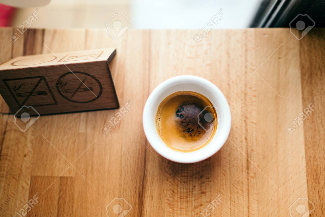 close up top view of strong coffee espresso at cafe shop on stock photo picture and royalty free image image 108638168 https www 123rf com photo 108638168 close up top view of strong coffee espresso at cafe shop on wooden background with no smoking sign html