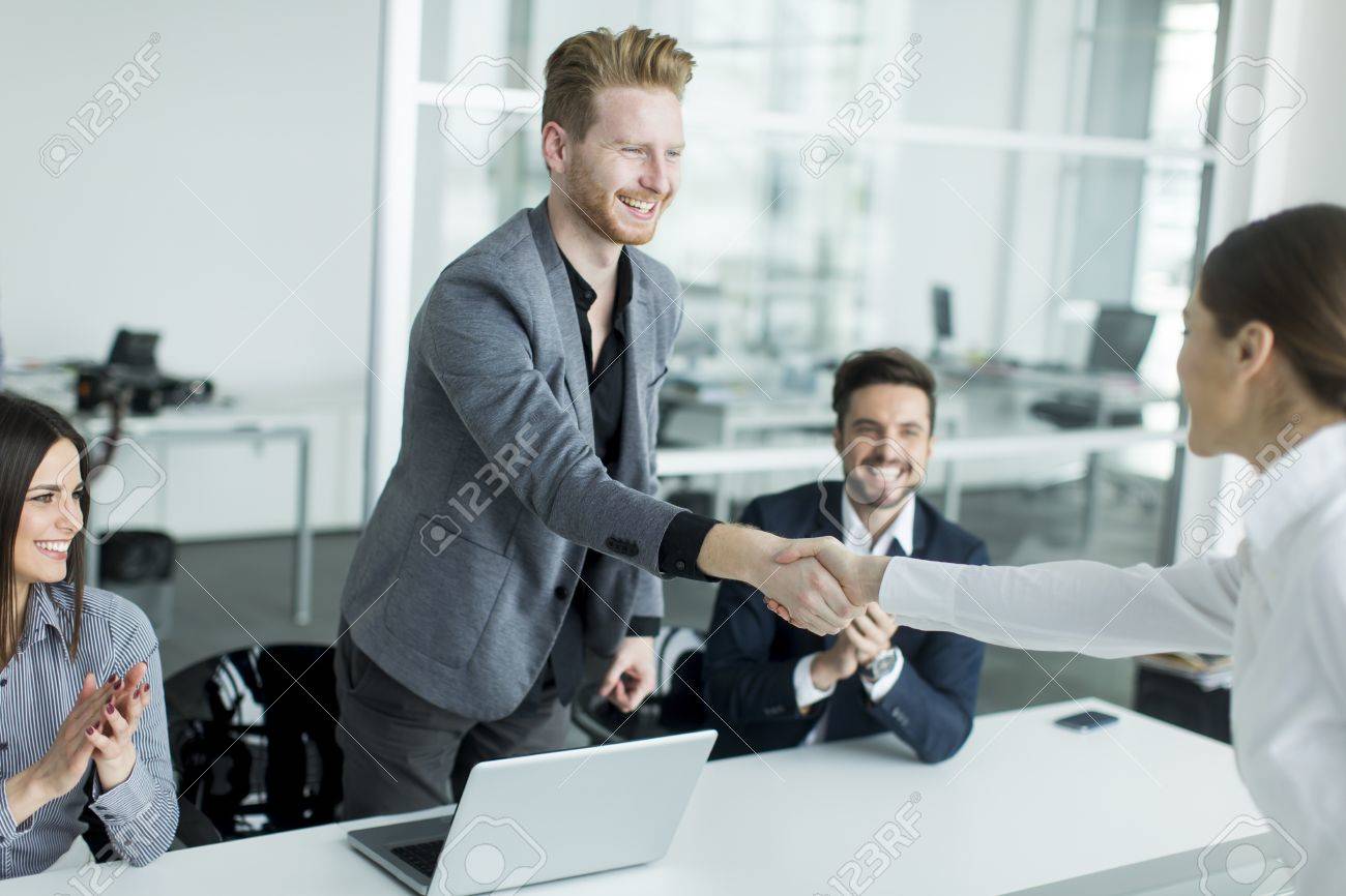 Business People Shaking Hands In The Office After A Job Well Done Stock Photo Picture And Royalty Free Image Image