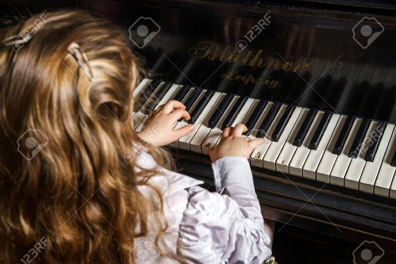 Cute little girl playing grand piano in music school, childhood concept - 39503376 Cute little girl playing grand piano in music school, childhood concept - 39503376