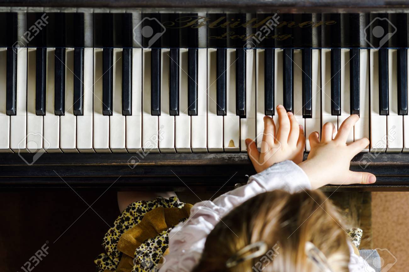 Cute little girl playing grand piano in music school, childhood concept - 39503387 Cute little girl playing grand piano in music school, childhood concept - 39503387