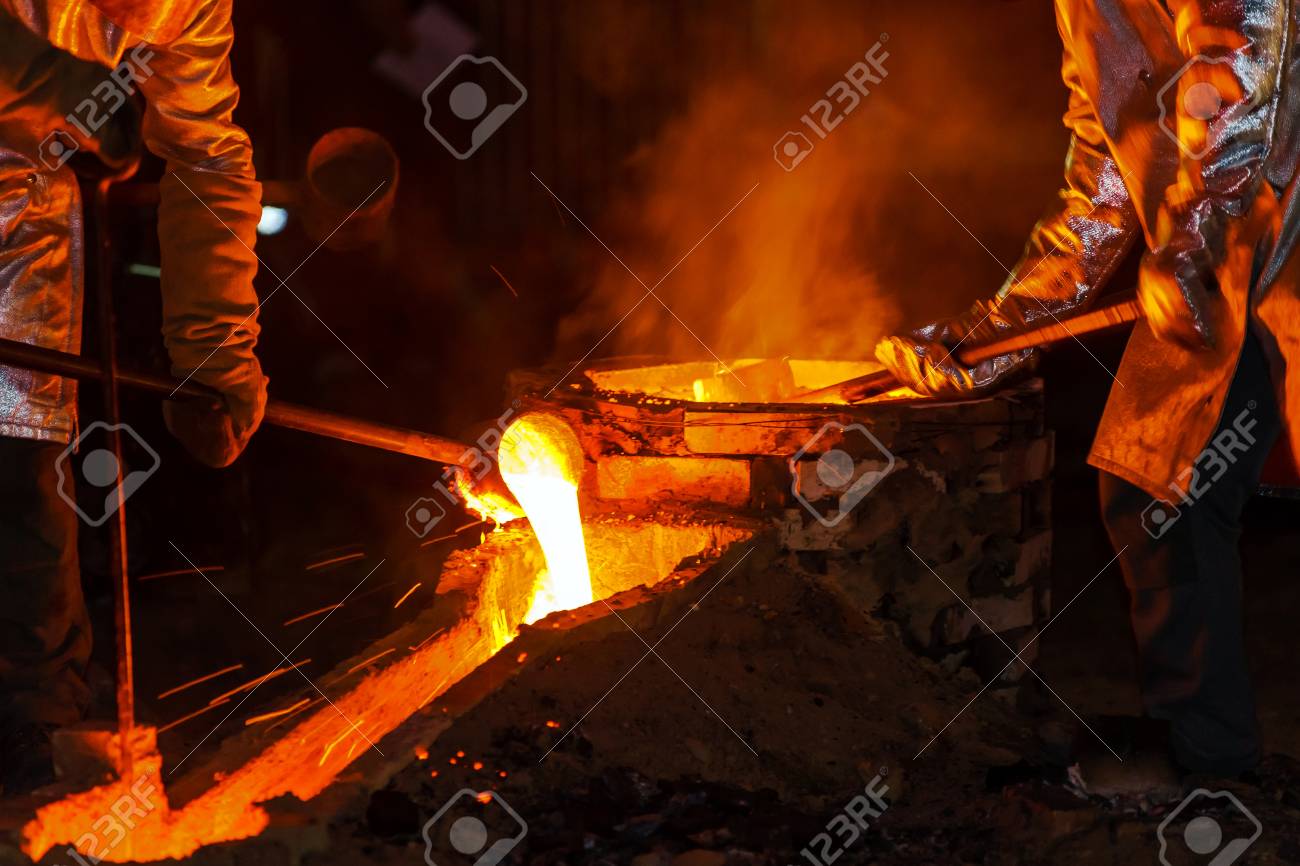 Classic technology of bell producing with melting steel in the ground. France. - 42583820 Classic technology of bell producing with melting steel in the ground. France. - 42583820