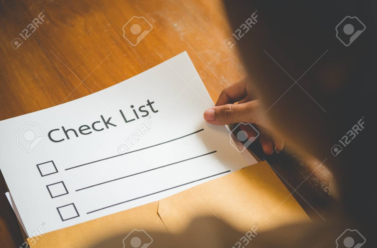women are opening an envelope document inside have checklist stock