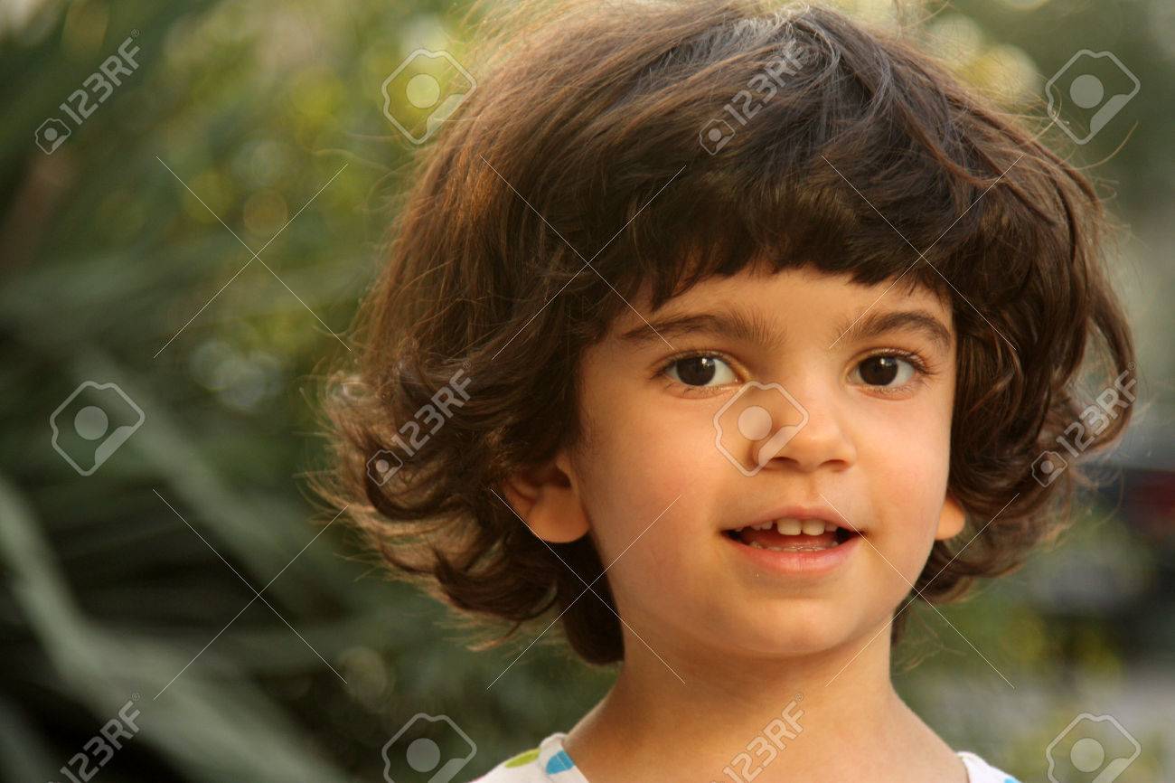 Smiling Little White Girl With Short Brown Hairs Stock Photo