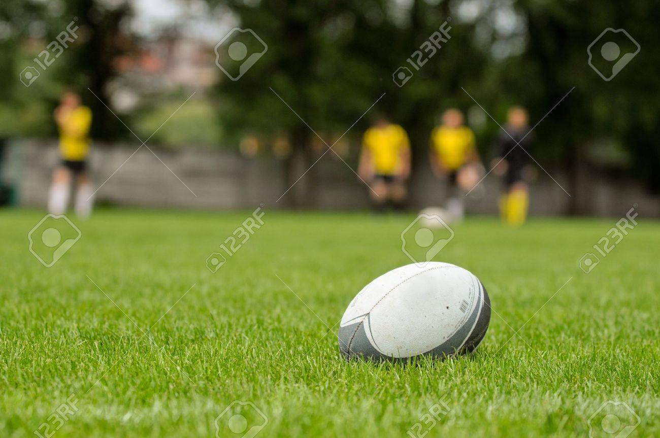 Rugby ball at green grass Photo taken at rugby training - 14096321 Rugby ball at green grass Photo taken at rugby training - 14096321