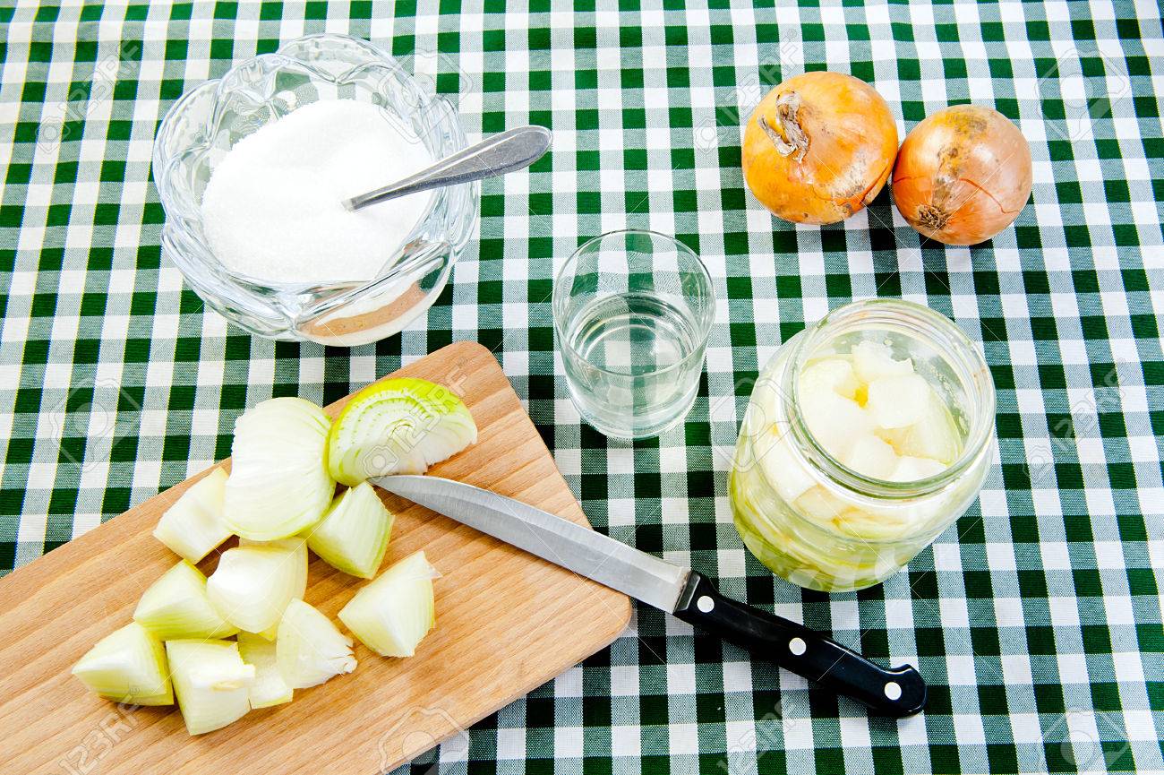 onion at wooden desk, sugar bowl onions and glass of onion syrup at table - 24696713 onion at wooden desk, sugar bowl onions and glass of onion syrup at table - 24696713