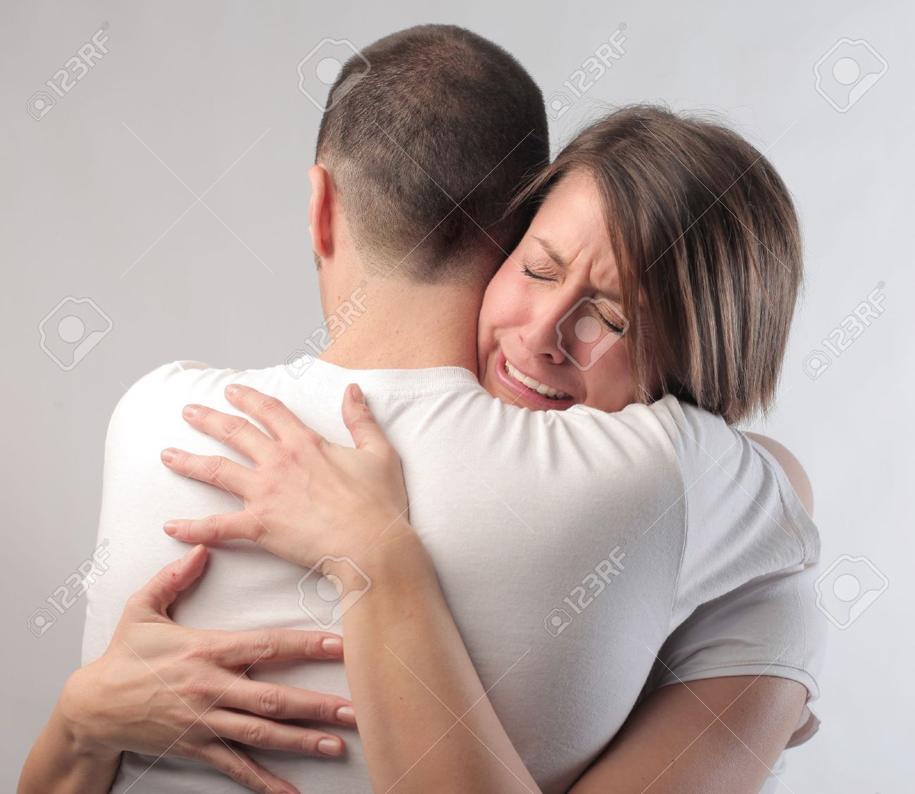 12648740-Sad-woman-hugging-her-husband-Stock-Photo-sad-hug-couple.jpg