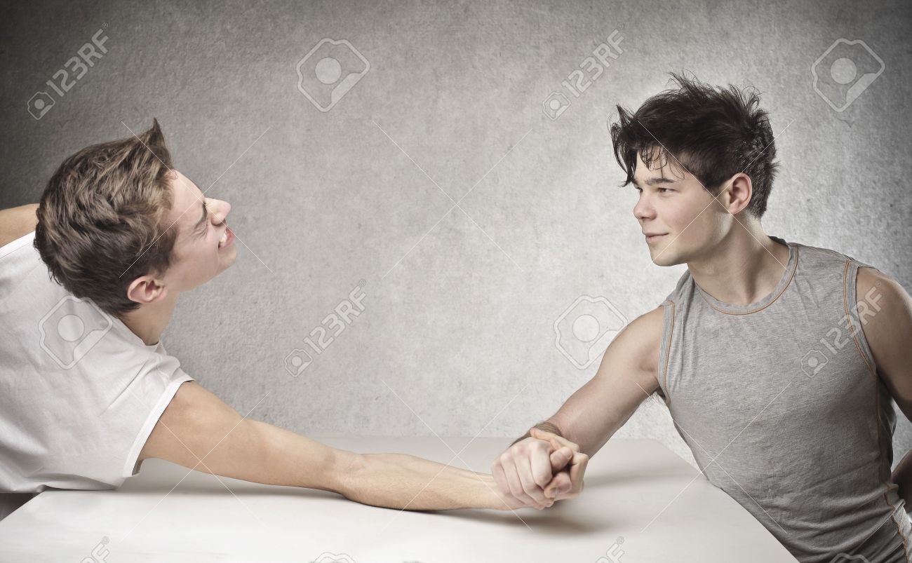 two friends challenge each other at arm wrestling - 18548067 two friends challenge each other at arm wrestling - 18548067