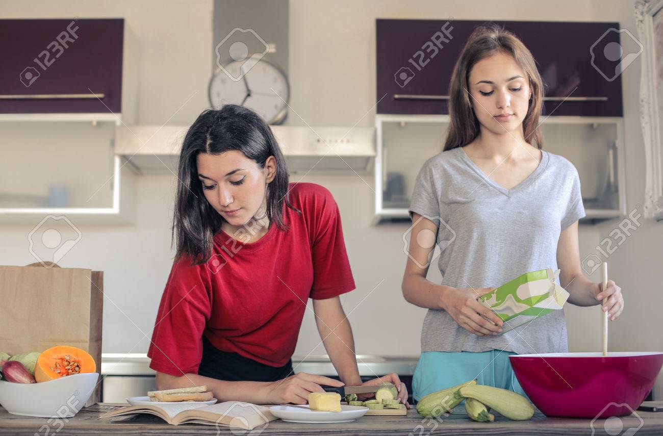 Two Girls Cooking Food In The Kitchen Stock Photo Picture And Royalty Free Image Image 44125913