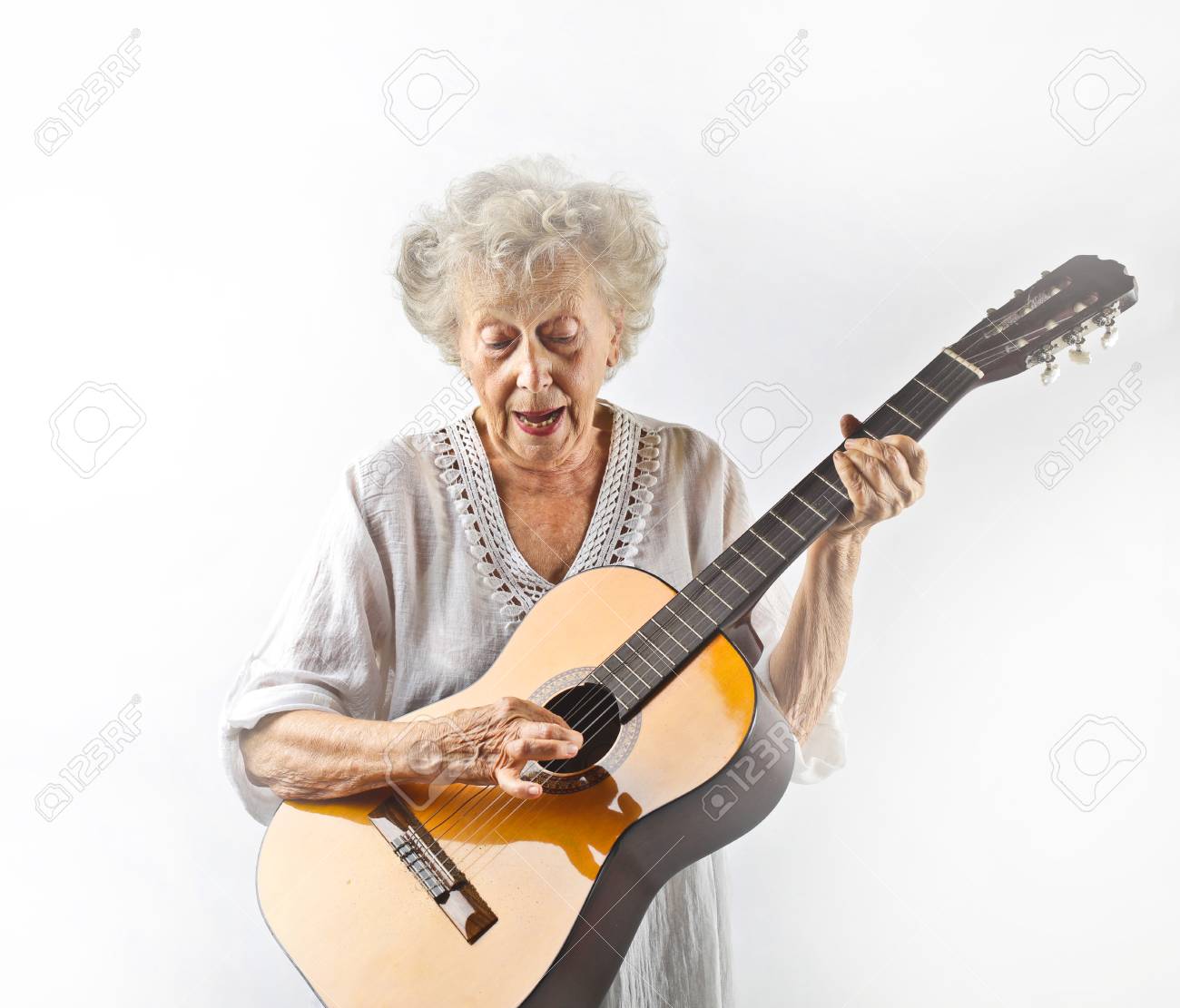 Aged Woman Playing Acoustic Guitar Stock Photo Aged Woman Playing Acoustic Guitar Stock Photo