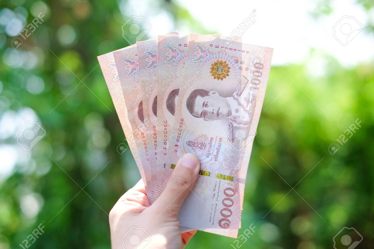Hand Holds Thai Money 5000 Baht (government Support People From Coronavirus  Or COVID-19 Situation) - Finance Thailand Concept. Stock Photo, Picture and  Royalty Free Image. Image 146217113.