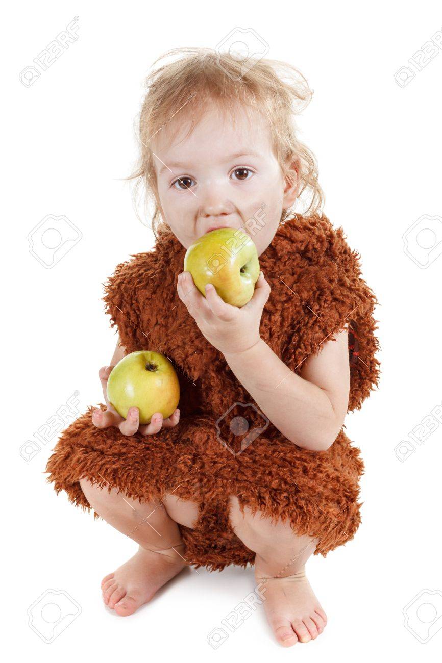 Little funny Neanderthal boy in a suit with a dirty face eating an apple. Humorous concept ancient caveman. Isolated on white. - 55644154 Little funny Neanderthal boy in a suit with a dirty face eating an apple. Humorous concept ancient caveman. Isolated on white. - 55644154
