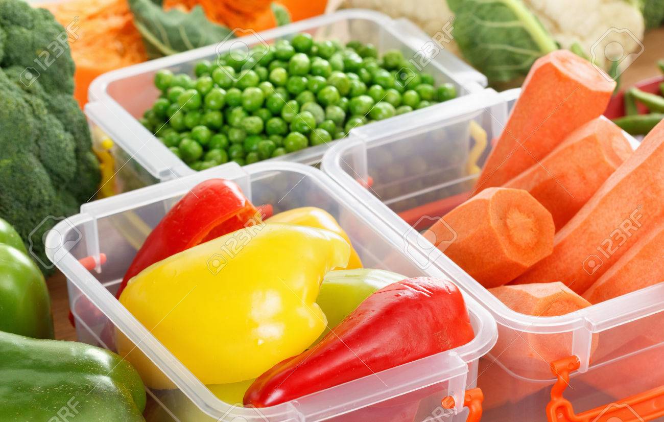Trays with raw vegetables for freezing. Stocking up for winter storage in plastic containers - 65592041 Trays with raw vegetables for freezing. Stocking up for winter storage in plastic containers - 65592041