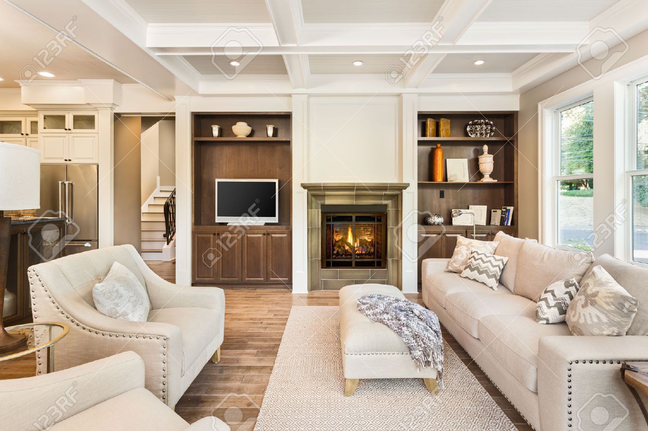 living room interior with hardwood floors in new luxury home stock