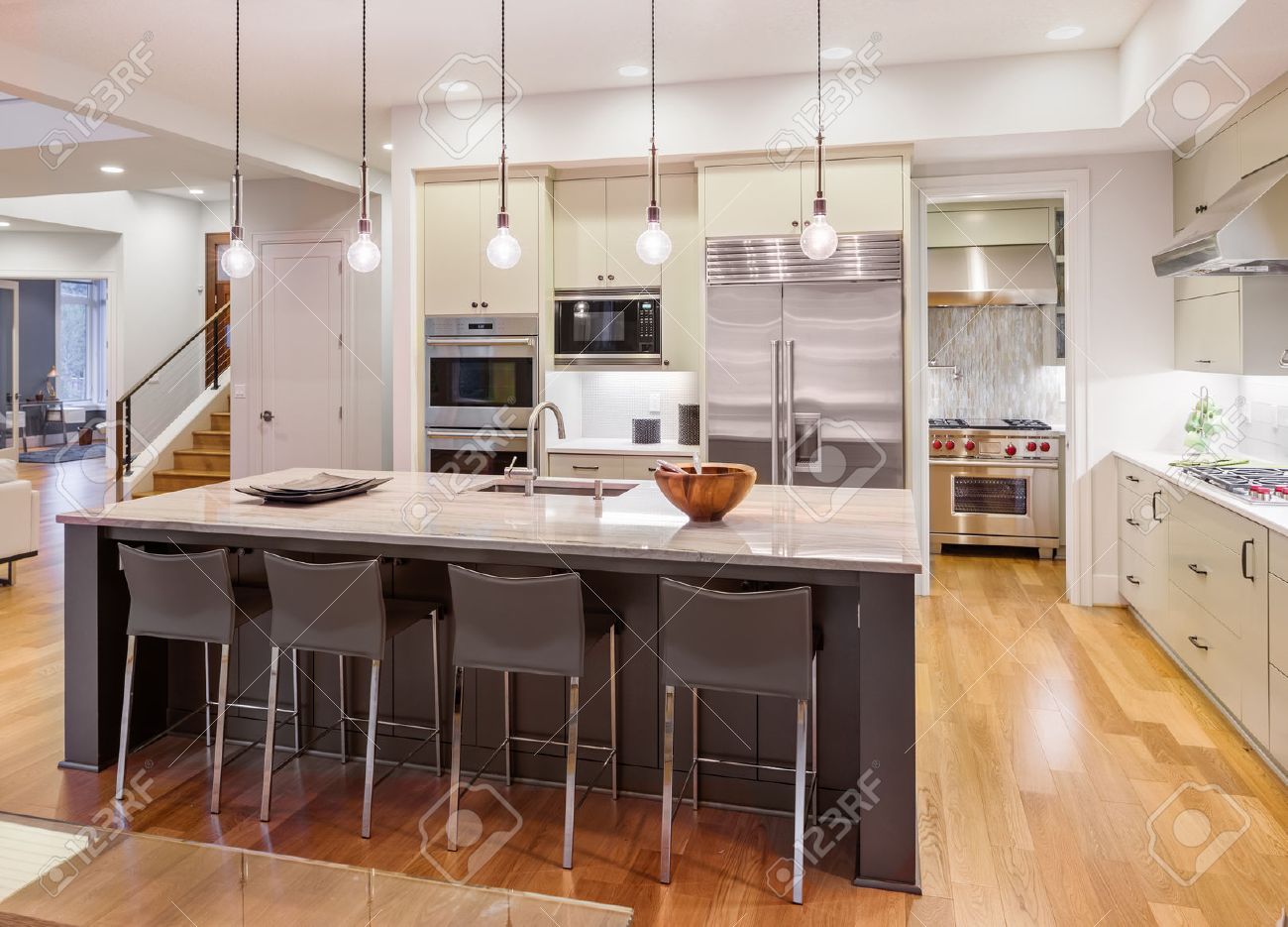 Kitchen Interior With Island Sink Cabinets And Hardwood Floors Kitchen Interior With Island Sink Cabinets And Hardwood Floors