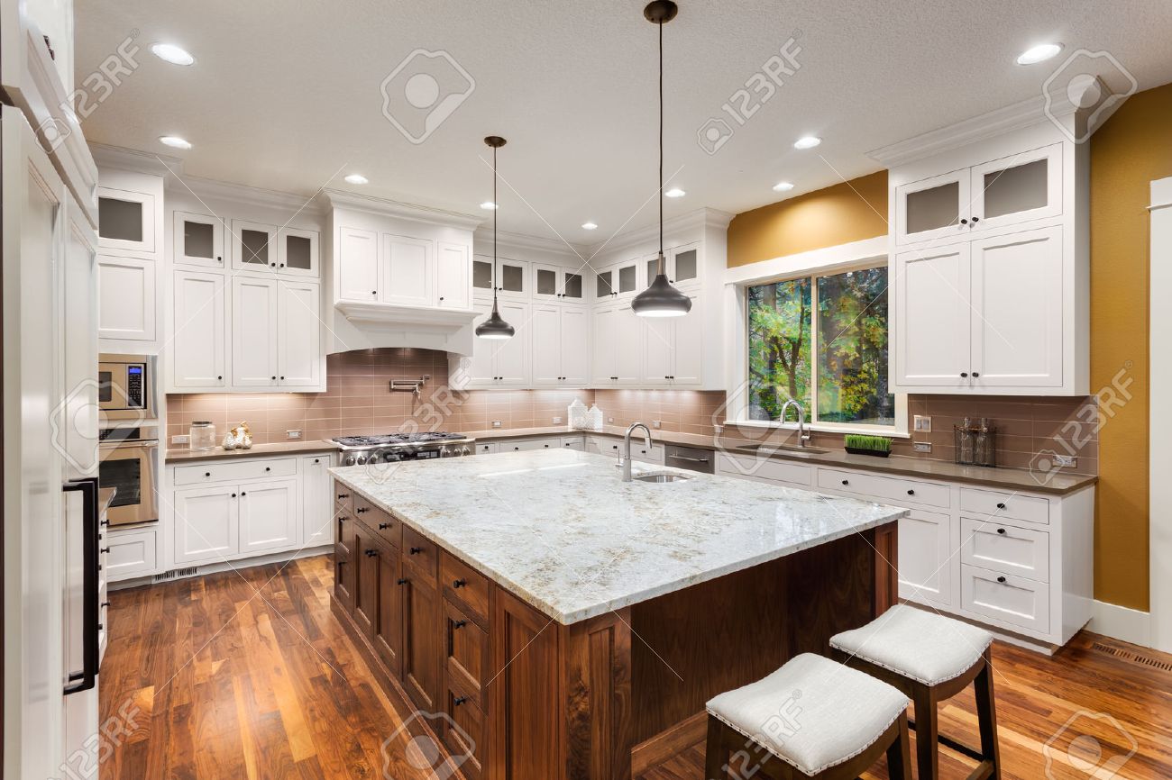 Large Kitchen Interior With Island, Sink, White Cabinets, Pendant Large Kitchen Interior With Island, Sink, White Cabinets, Pendant