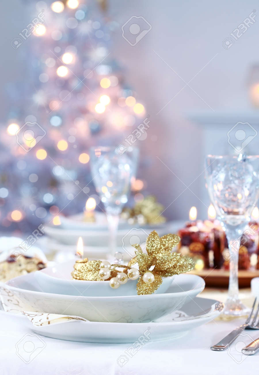 Dinner Table Background place setting with christmas tree in background stock photo Dinner Table Background place setting with christmas tree in background stock photo