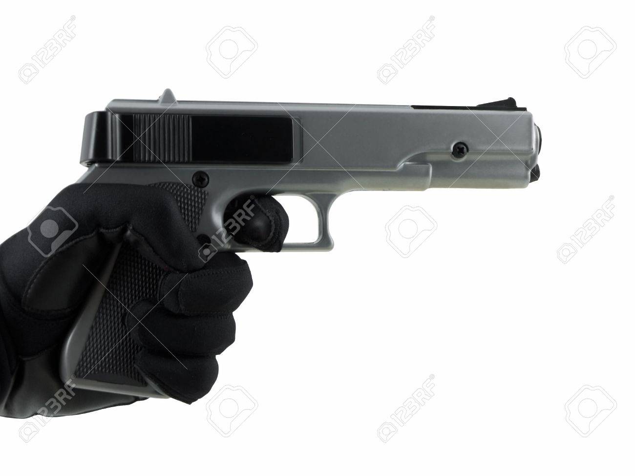 白で隔離され 拳銃を持っている手袋をはめた手 の写真素材 画像素材 Image 白で隔離され 拳銃を持っている手袋をはめた手 の写真素材 画像素材 Image