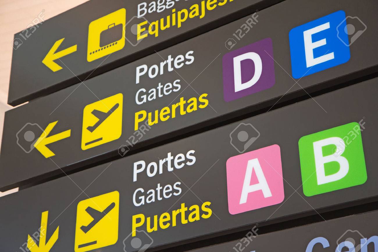 Airport Signs in English and Spanish language. - 32645884 Airport Signs in English and Spanish language. - 32645884
