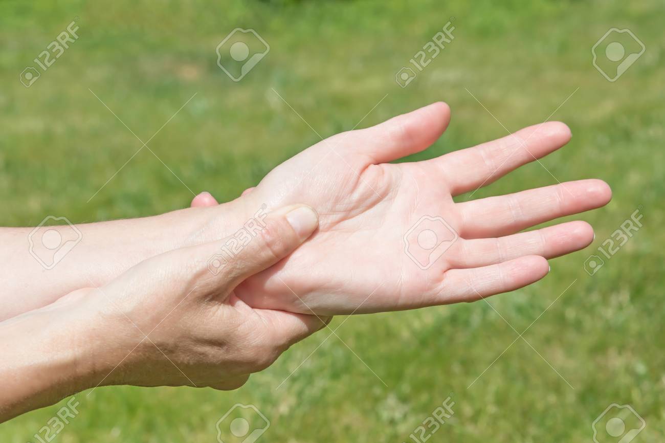 Female hands showing carpal tunnel syndrome problem outdoors - 60225692 Female hands showing carpal tunnel syndrome problem outdoors - 60225692