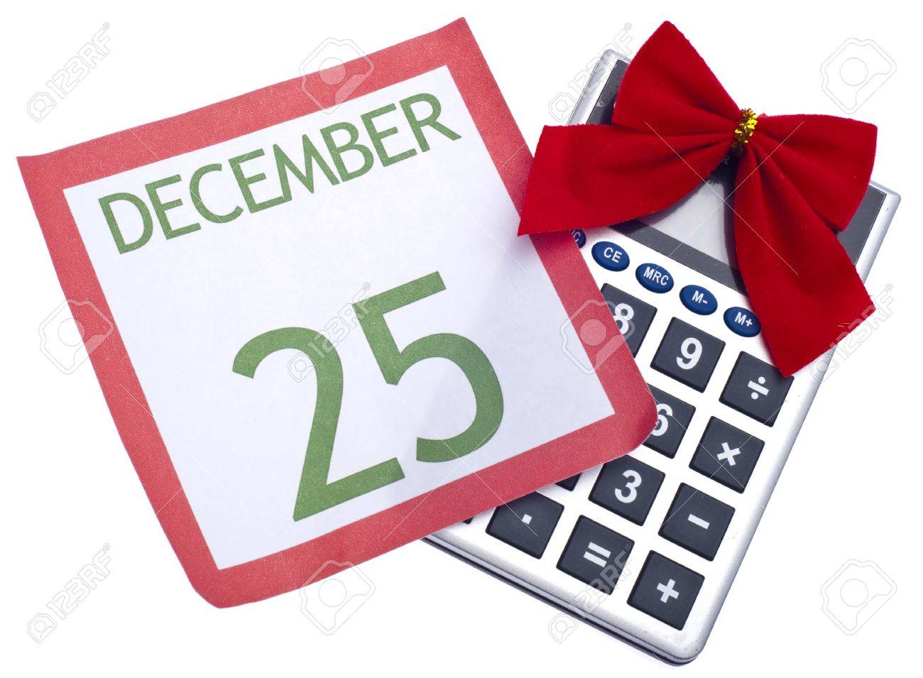calculator with holiday bow and calendar page christmas budget