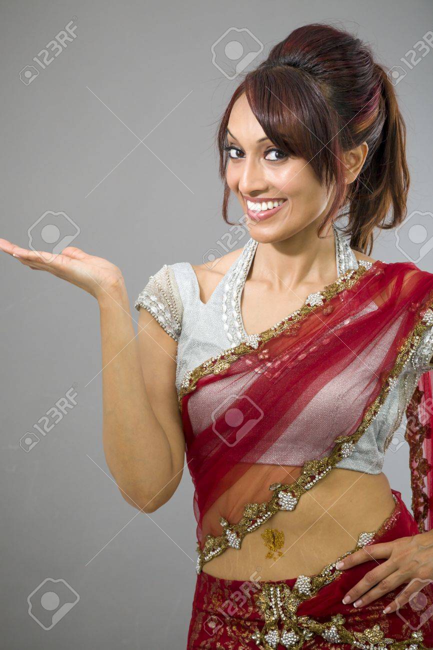 Young Indian Woman Showing Product With photo