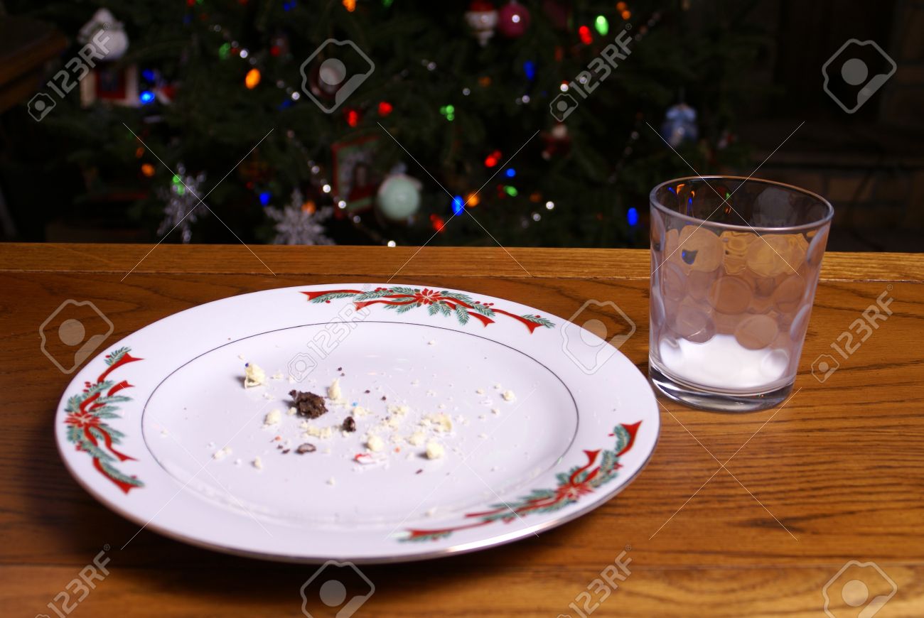 A Plate Of Cookie Crumbs And Empty Glass Of Milk Left By Santa.. Stock Photo, Picture And Royalty Free Image. Image 16741655.