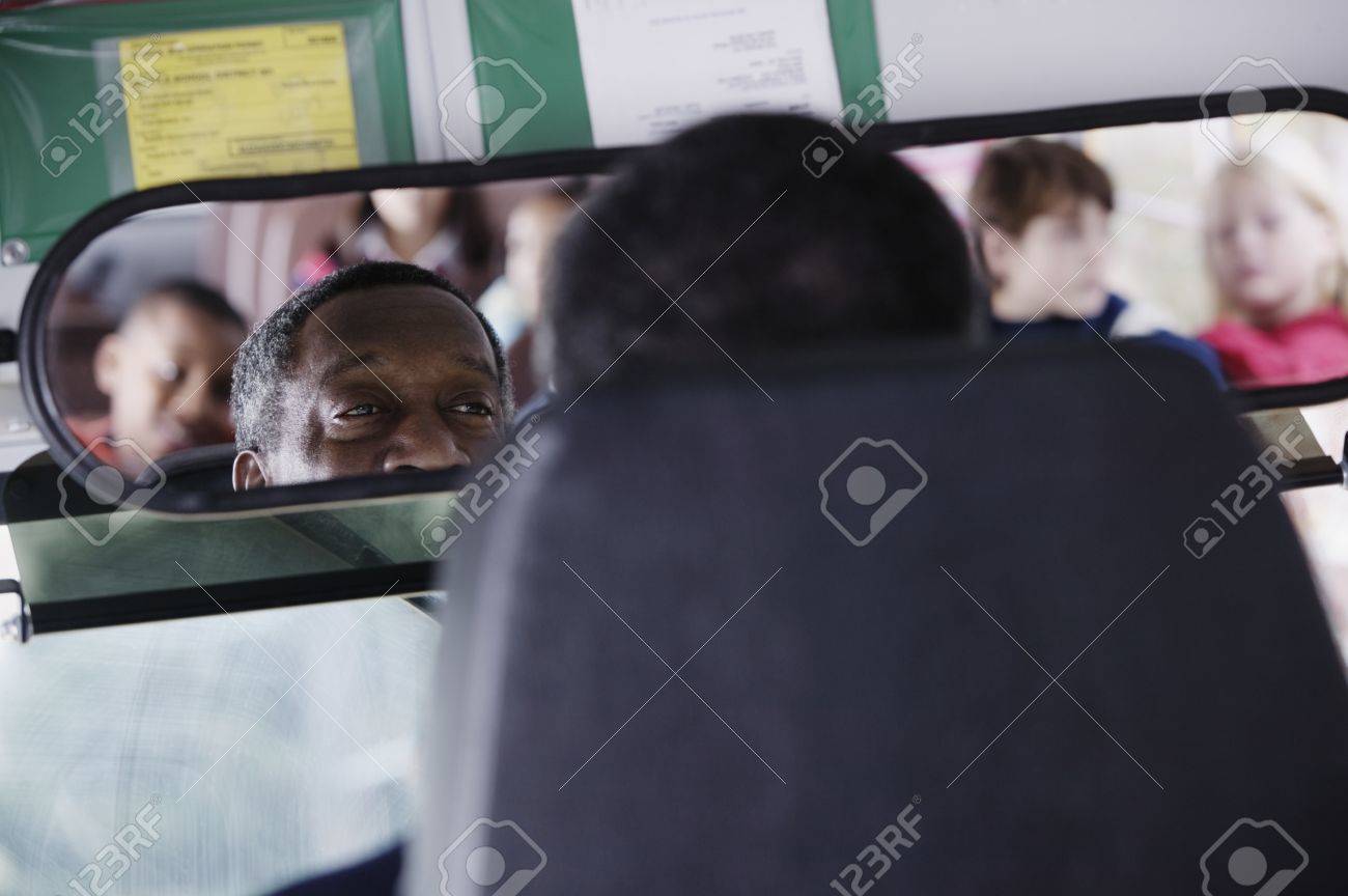 School Bus Driver Looking At Kids In Rearview Mirror Stock Photo, Picture and Royalty Free Image. Image 16045668.