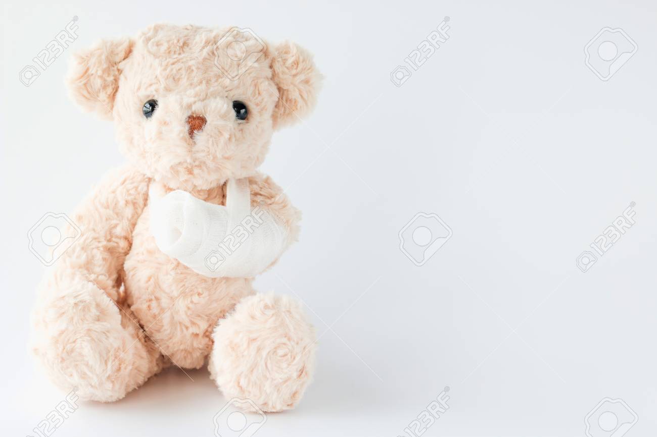 teddy bear in hand