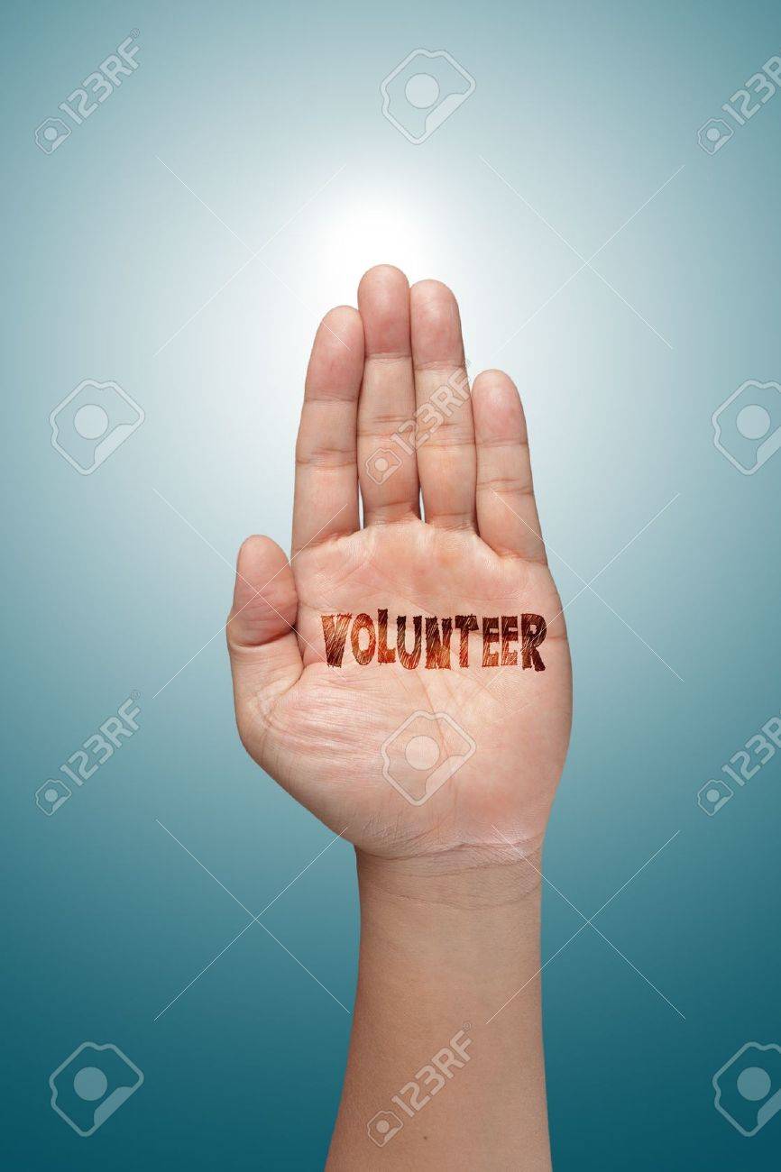 volunteer raising hand against blue sky backgroun - 14731723 volunteer raising hand against blue sky backgroun - 14731723