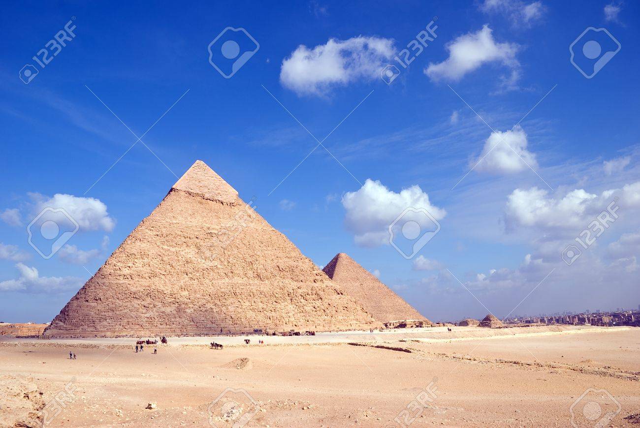 Egypt. Giza. View of the Hefren and Cheops pyramids with Cairo at a distance. - 12375092 Egypt. Giza. View of the Hefren and Cheops pyramids with Cairo at a distance. - 12375092