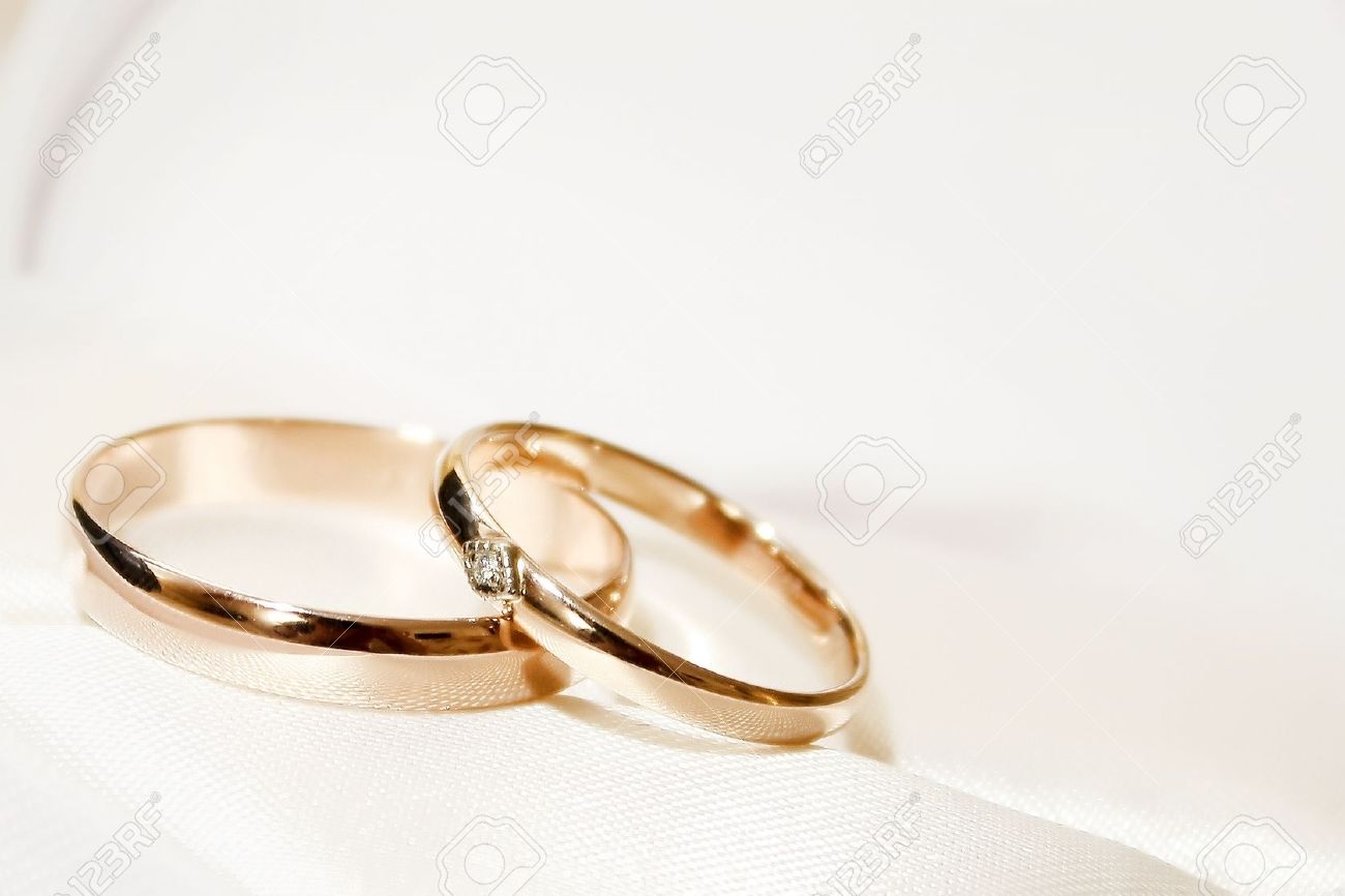 abstract scene with wedding rings as celebration background stock