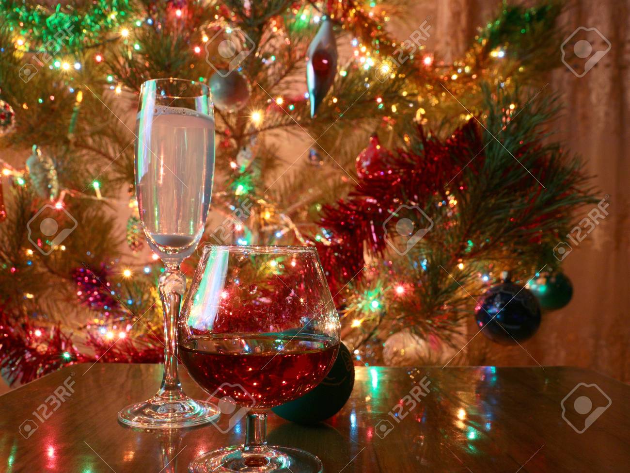 glasses of wine and strong liquor on a background of brightly