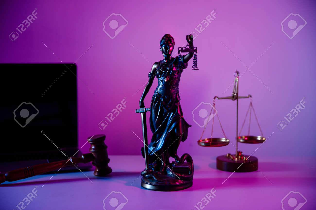 Bronze statue Lady Justice with scales in notary office on purple background - 169819666 Bronze statue Lady Justice with scales in notary office on purple background - 169819666