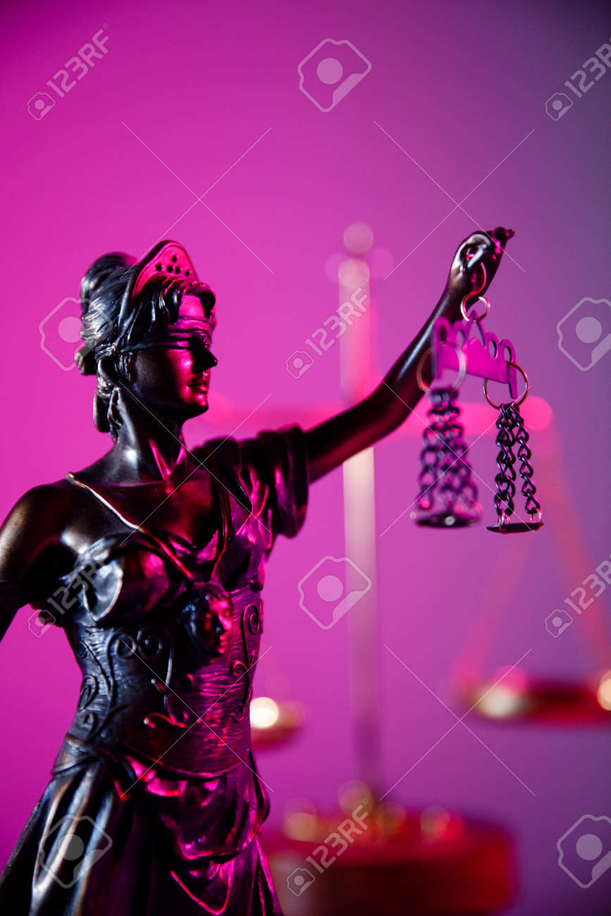 Law and judgment concept. Figure of Lady Justice in purple neon. Vertical image - 169819665 Law and judgment concept. Figure of Lady Justice in purple neon. Vertical image - 169819665