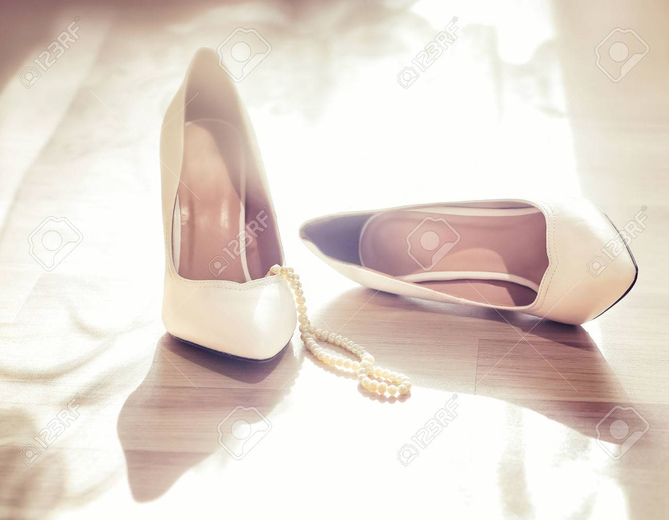 white shoes with pearls