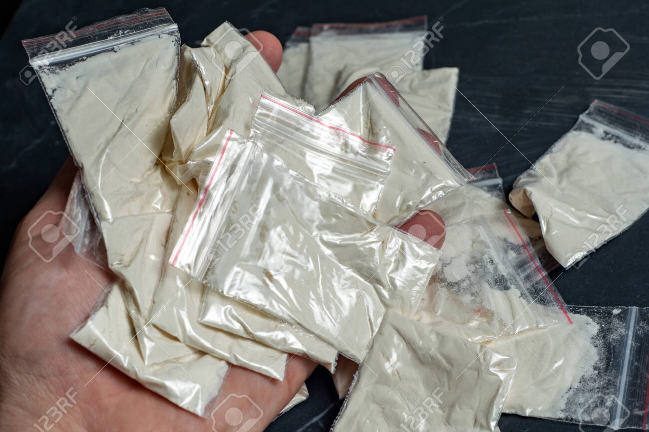 Download Drug Trade A Dope Sachet Against The Backdrop Of Many Packaged Doses Of Cannabis Cocaine And Heroin Stock Photo Picture And Royalty Free Image Image 145079948