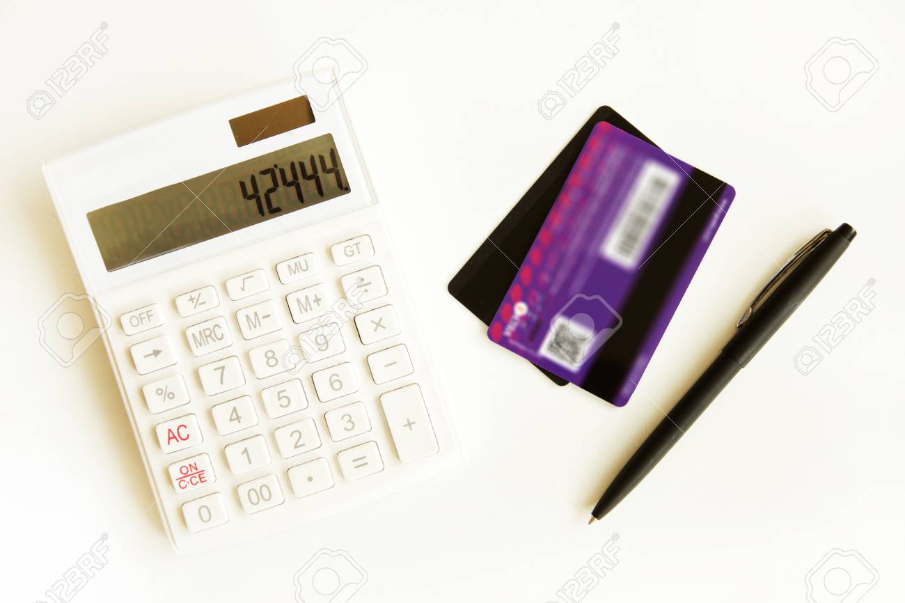 credit card with calculator on table calculator credit card