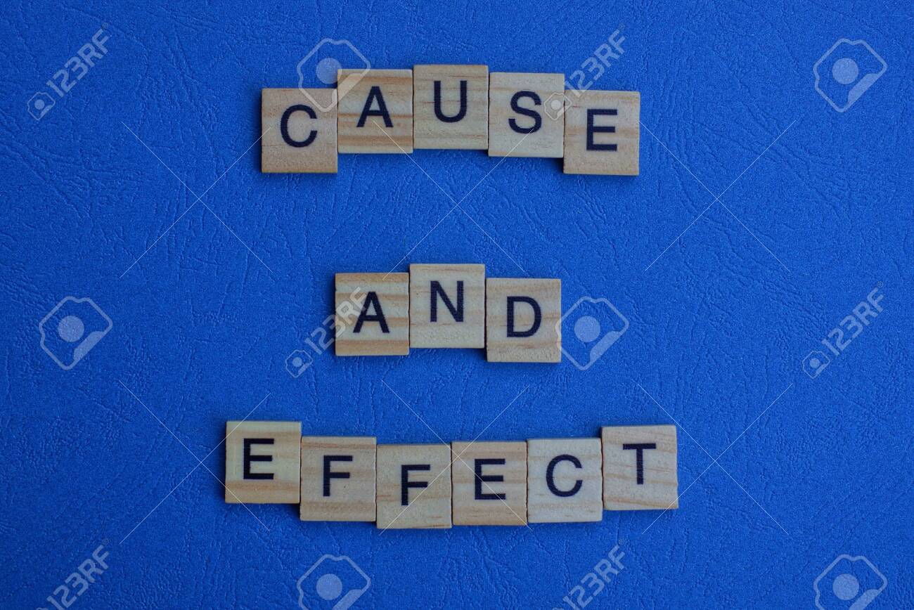 the phrase cause and effect of brown wooden letters lies on a blue table - 134933291 the phrase cause and effect of brown wooden letters lies on a blue table - 134933291