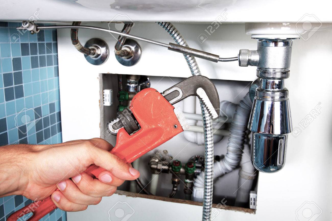plumbing work and sanitary engineering repairing a pipe under sanitary works