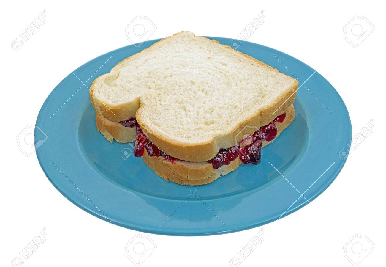 A Peanut Butter And Grape Jelly Sandwich Made With White Bread On A Blue Plate Stock Photo Picture And Royalty Free Image Image