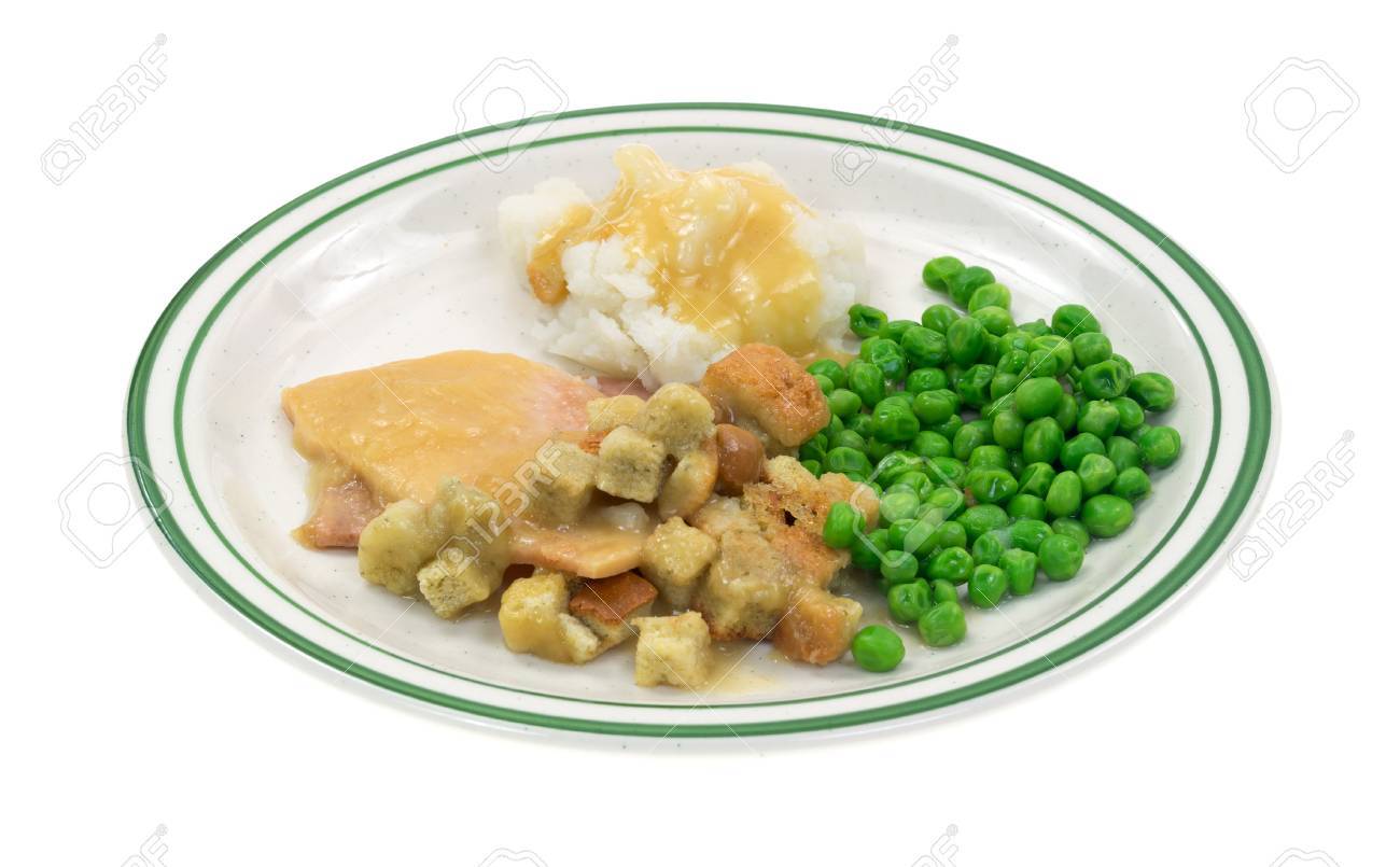 Ein Puten In Sosse Mit Croutons Kartoffelbrei Und Erbsen Auf Einem Teller Lizenzfreie Fotos Bilder Und Stock Fotografie Image 32578695