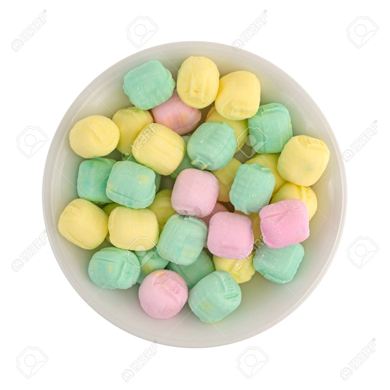 top view of after dinner mint candies filling a bowl isolated