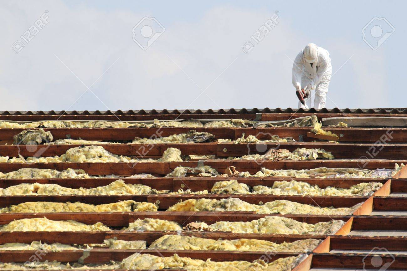 workman at rooftop of building being remediated - 52074795 workman at rooftop of building being remediated - 52074795