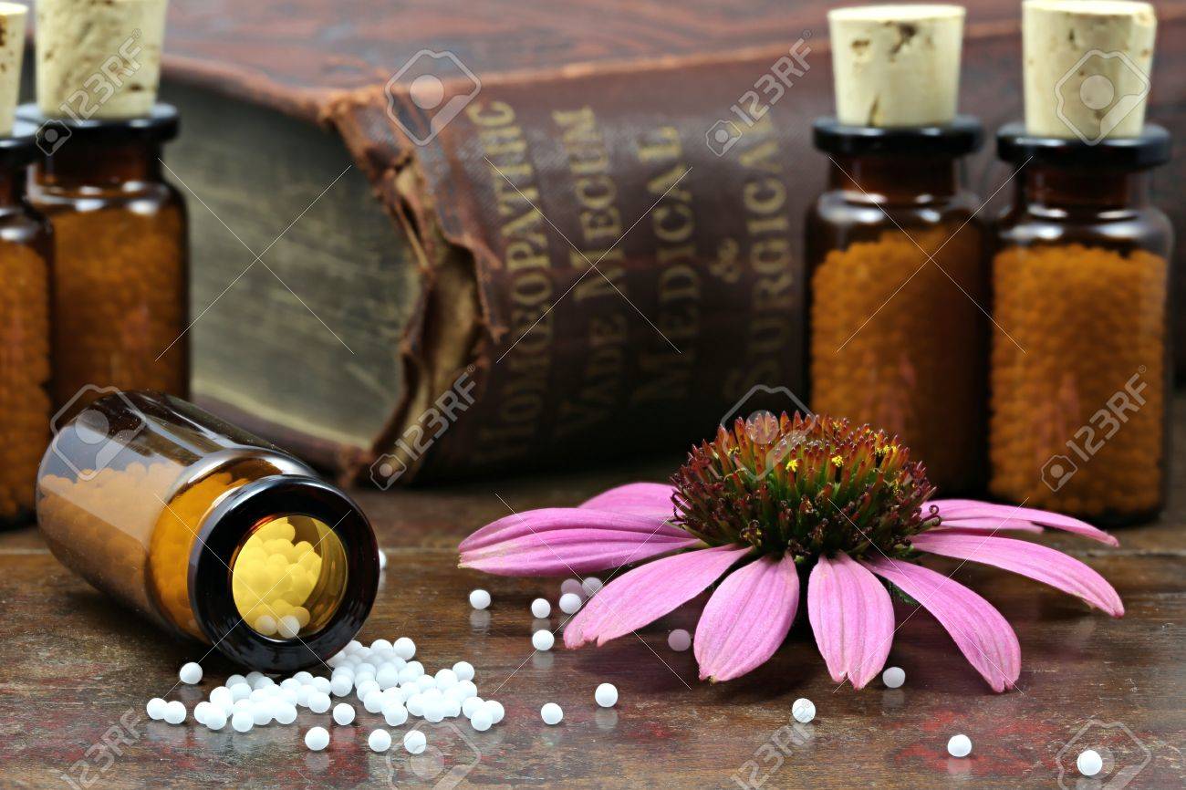 homeopathic echinacea pills on wooden background - 64279074 homeopathic echinacea pills on wooden background - 64279074