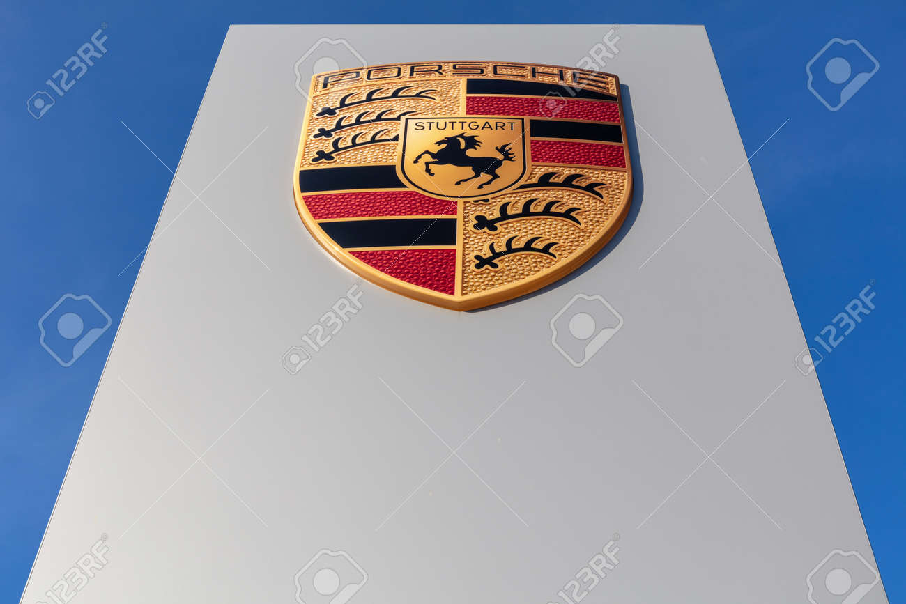 Porsche dealership sign against blue sky - 171646086 Porsche dealership sign against blue sky - 171646086