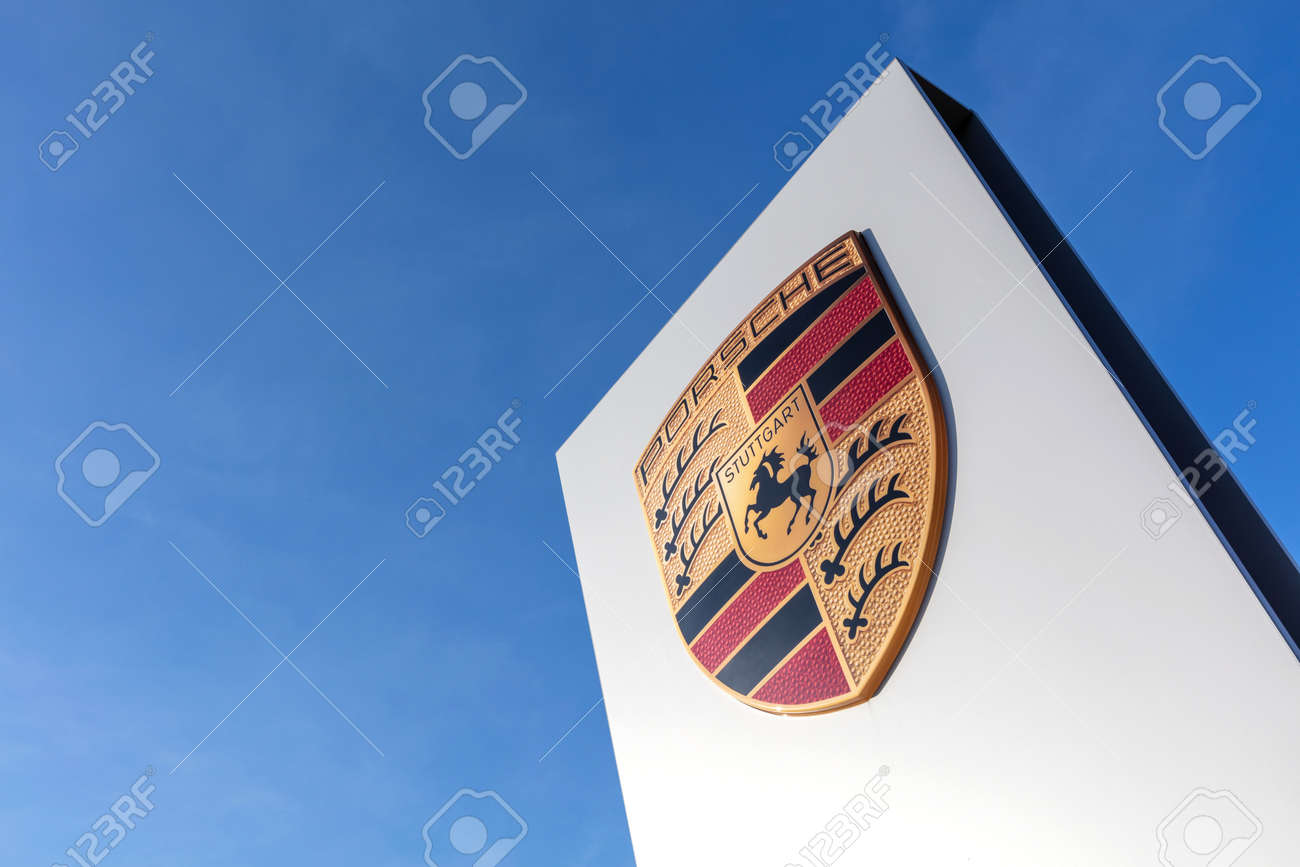 Porsche dealership sign against blue sky - 171646087 Porsche dealership sign against blue sky - 171646087