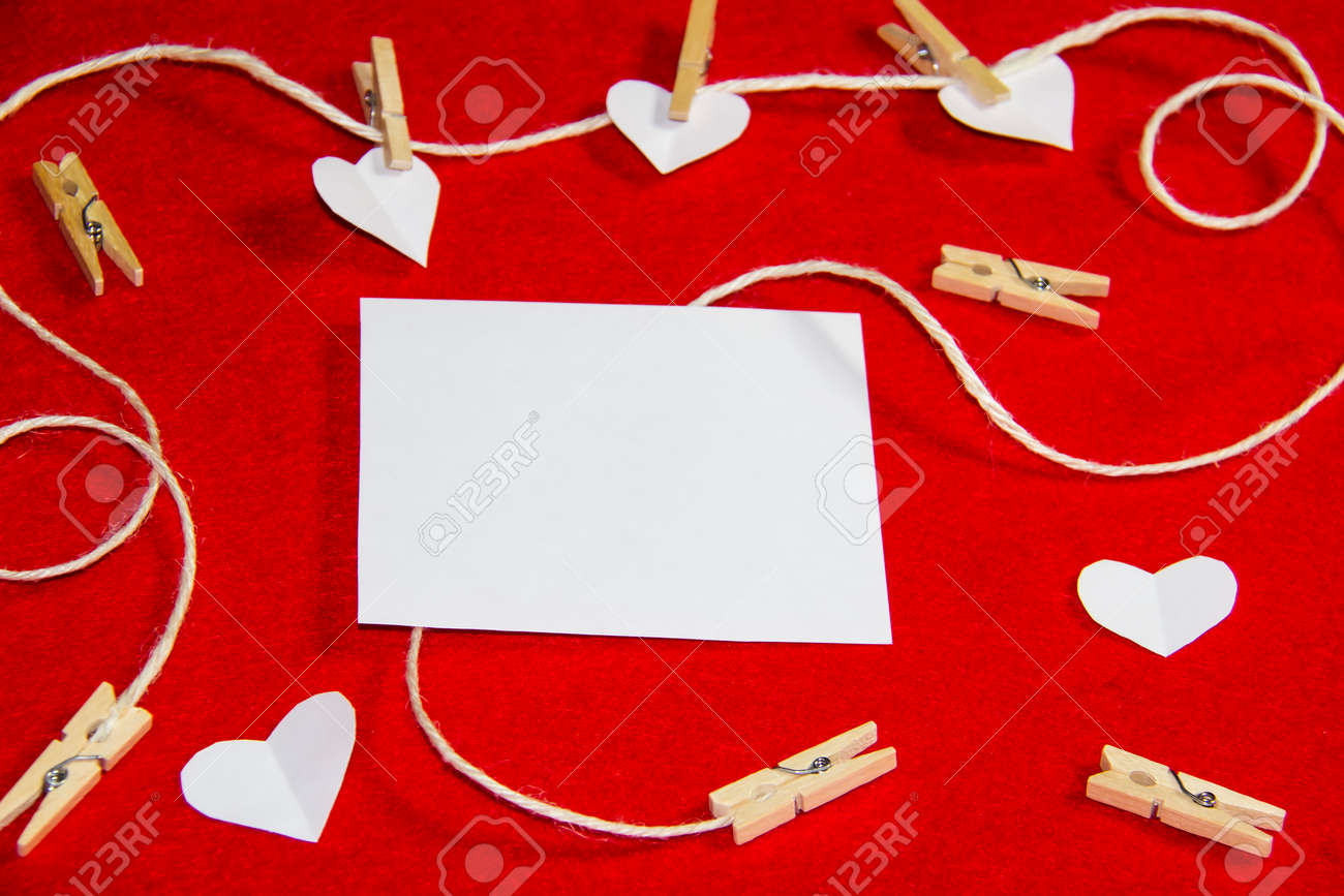 A red background from felt. A composition from heart, thread and clothespins. Background with place for write for valentines day and christmas. - 148565232 A red background from felt. A composition from heart, thread and clothespins. Background with place for write for valentines day and christmas. - 148565232