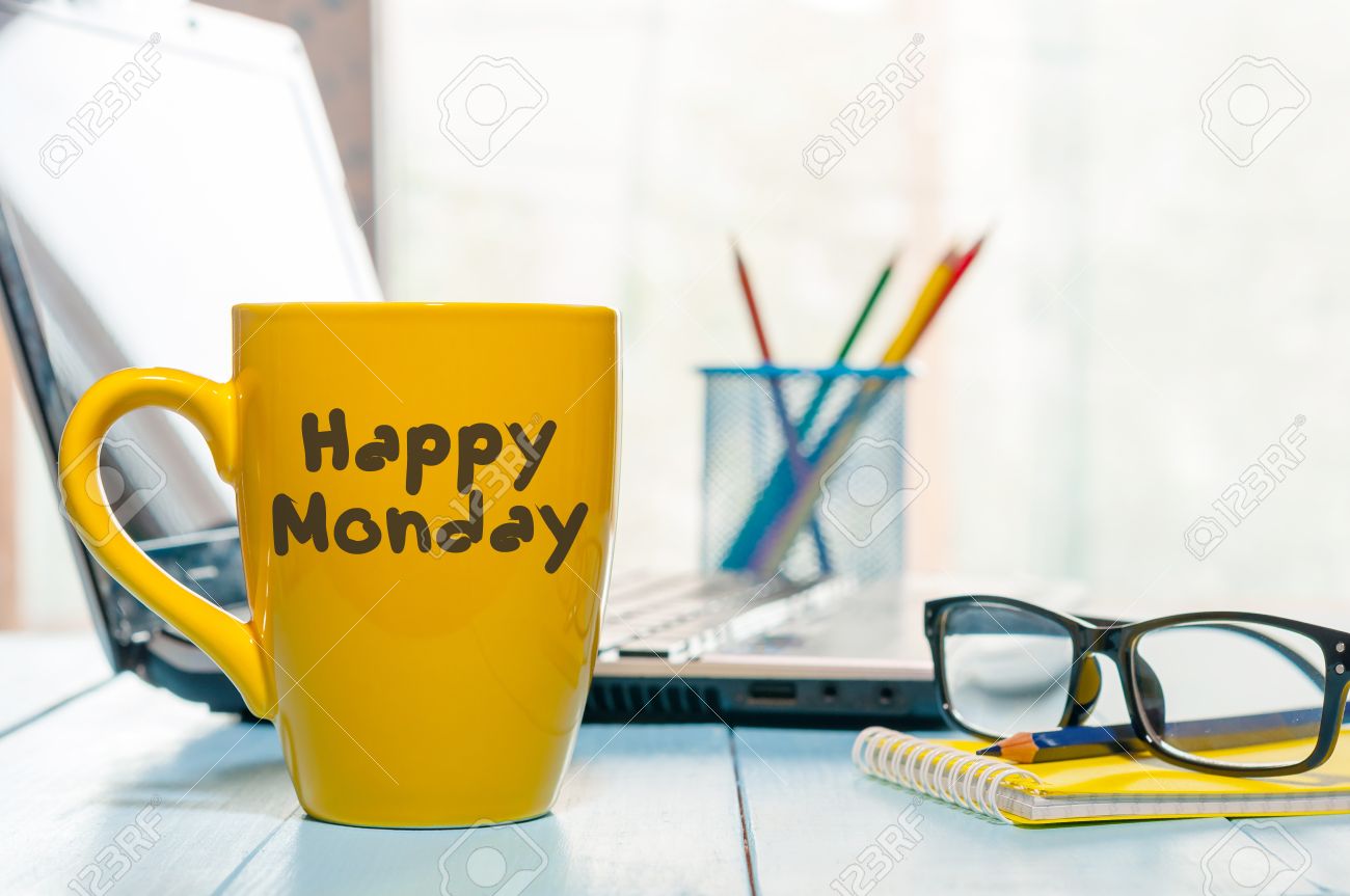 Happy Monday motivational text on yellow morning coffee cup near computer at office workplace. Business background. - 64156236 Happy Monday motivational text on yellow morning coffee cup near computer at office workplace. Business background. - 64156236